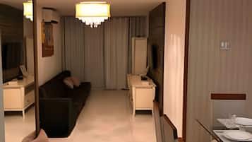 Deluxe Apartment, Lanai, Sea View | Living area | TV