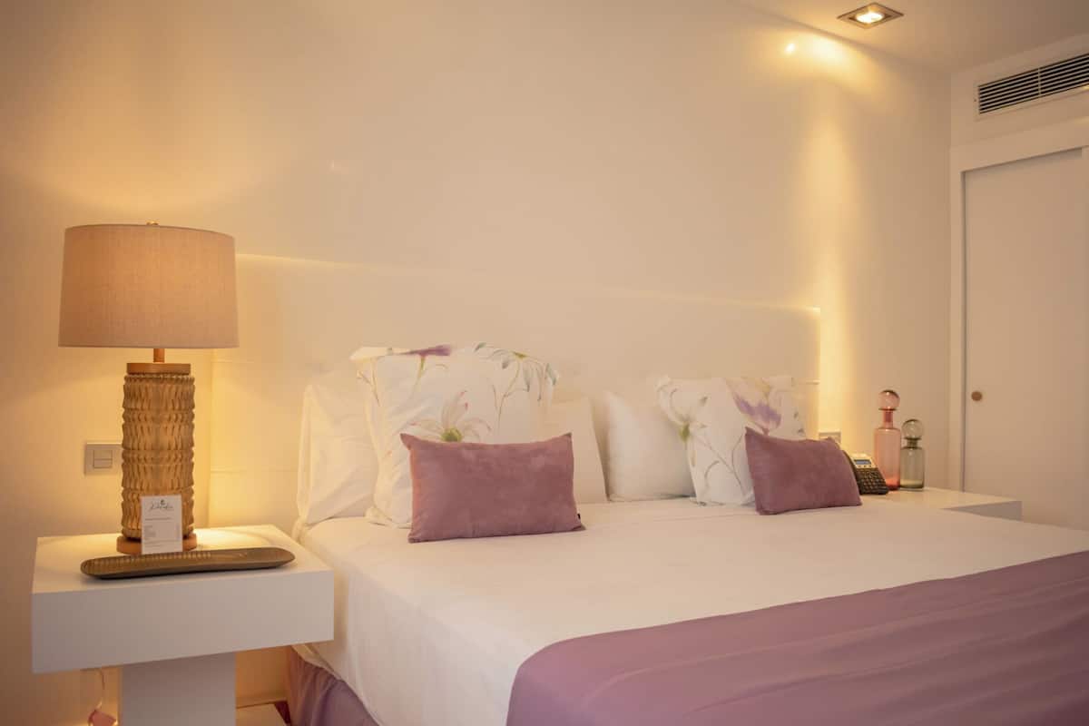 Suite, Balcony, Garden View | In-room safe, individually decorated, individually furnished