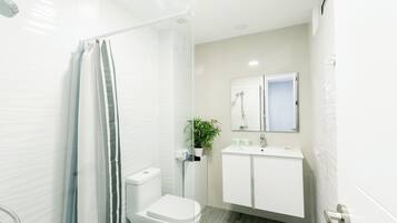 Suite, City View | Bathroom | Shower, hair dryer, towels, soap