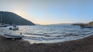 A beach with boats and a pier. - Villa Mariposa - Luxury Summer Residence (Turgutköy)