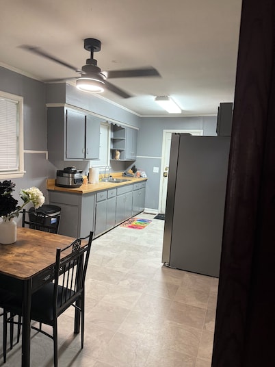  Cozy 3-Bedroom Cottage with Carport & Shaded Yard. Nestled under a big tree.