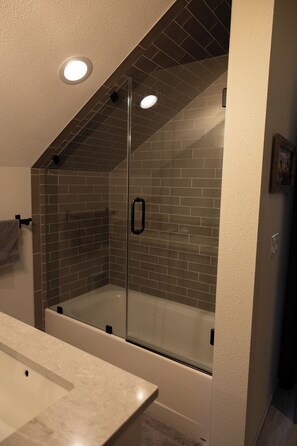 Shower, hair dryer, towels, soap