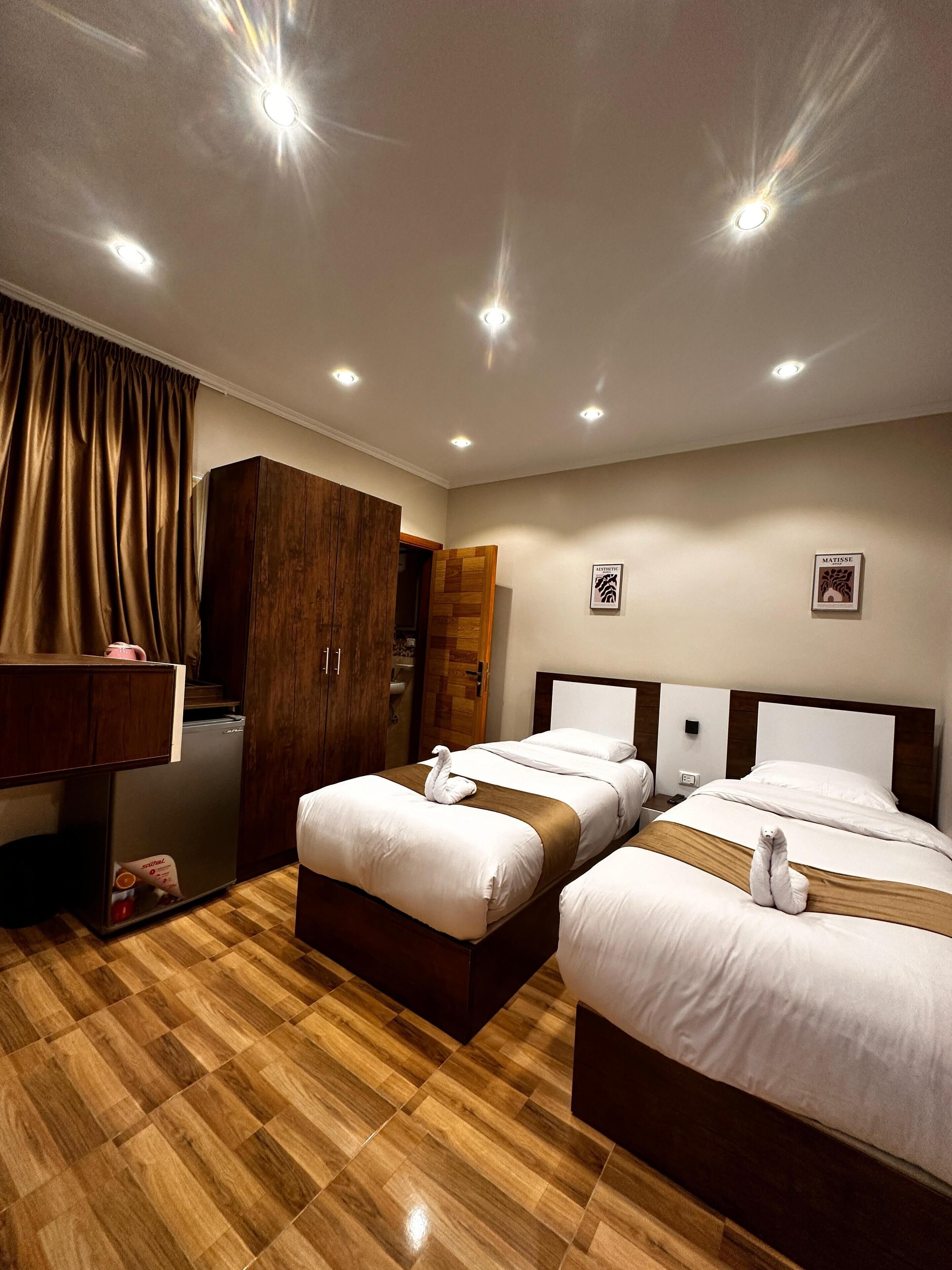 Deluxe Double or Twin Room | Desk, blackout drapes, iron/ironing board, free WiFi