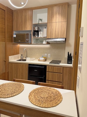 Fridge, microwave, stovetop, coffee/tea maker