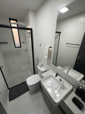 Shower, hair dryer, towels, toilet paper