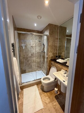 Shower, hair dryer, towels, soap