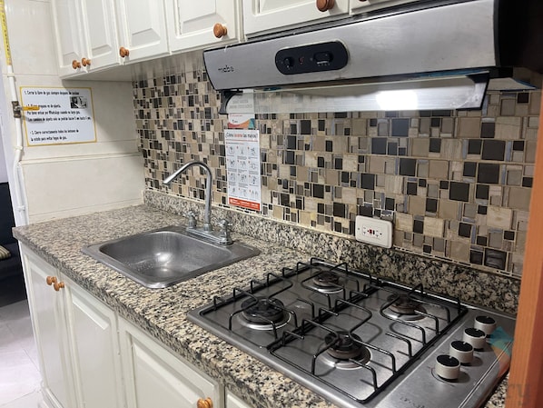 Fridge, microwave, stovetop, coffee/tea maker