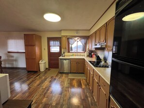 Microwave, oven, stovetop, dishwasher - Family-friendly three bedroom home on S US 41 in Vigo County; Terre Haute, IN. (Terre Haute)