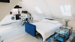 A compact, modern apartment with a loft-style bedroom, a kitchenette, and a dining area. - Sewwa - In the heart of Alsace at Sélestat (Sélestat)