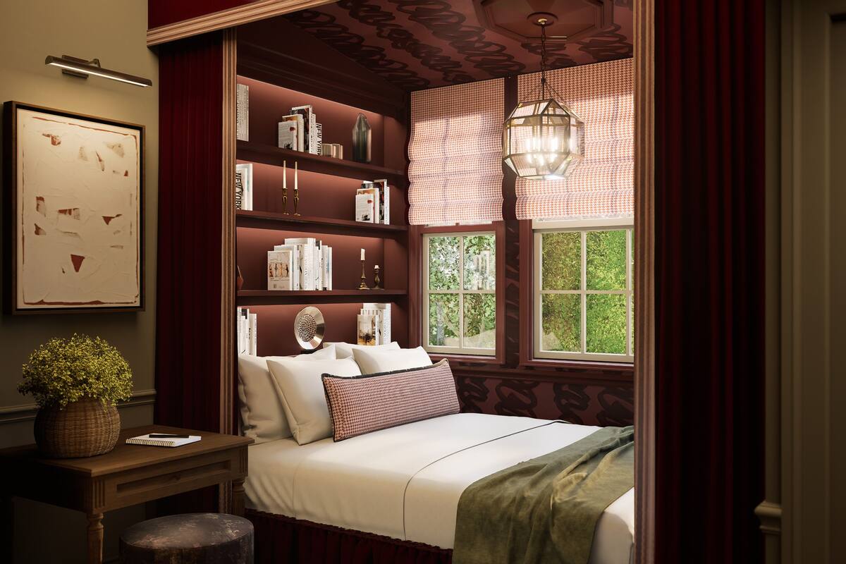 A bedroom with a large window, a bookshelf, and a bedside table with a plant.