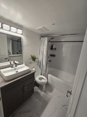 Shower, hair dryer, towels, soap