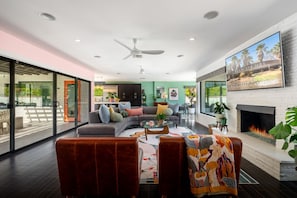 Smart TV, fireplace, books, offices