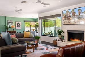 Smart TV, fireplace, books, offices