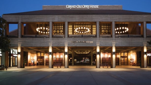 A hotel with a grand entrance, multiple floors, and a prominent sign reading "Grand Ole Opry House". - Rooftop retreat with views of Belmont-Near The Gulch! (Nashville)