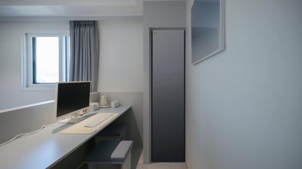 Premium bedding, desk, laptop workspace, soundproofing