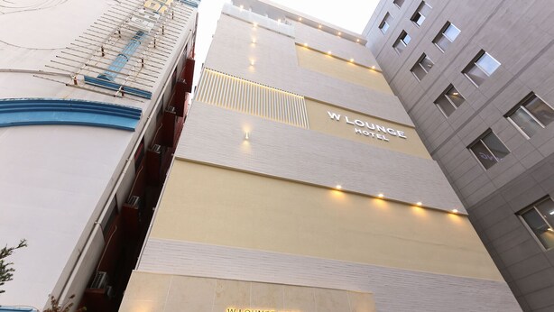 A multi-story hotel with a prominent 'W Lounge Hotel' sign on the facade. - Gwangju W Lounge Hotel (Gwangju)