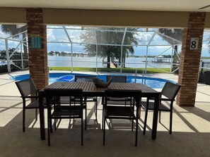 Outdoor dining - Lake Sirena Retreat, 5 BR Lakefront Oasis w/Pool, Kayaks, Sauna, Paddle Boards (Lake Placid)