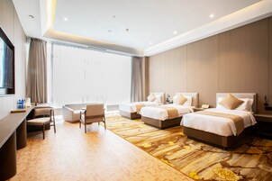 Superior Triple Room | Minibar, in-room safe, desk, laptop workspace