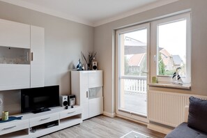 Apartamento conforto, 3 quartos | Sala de estar
