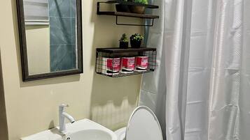 Shower, free toiletries, hair dryer, slippers