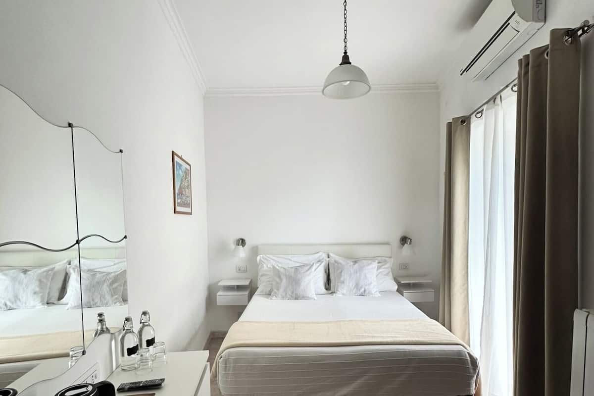 Economy Room, Balcony | Minibar, in-room safe, desk, blackout drapes