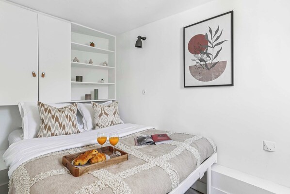 1 bedroom, desk, iron/ironing board, travel crib