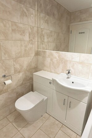 Hair dryer, towels, soap, shampoo