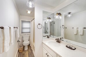 A bathroom with a white sink, a large mirror, and a toilet. - Walk to Shops, Eats & Trails: Blowing Rock Escape! (Blowing Rock)