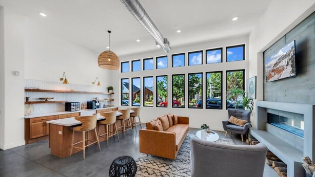 A modern living space with a kitchen, dining area, and seating area. - Sugarhouse-1BR 1BA Great Views! (Salt Lake City)