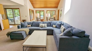 Signature House, 5 Bedrooms, Patio, Lake View | Living room | 50-inch Smart TV with digital channels, fireplace, foosball