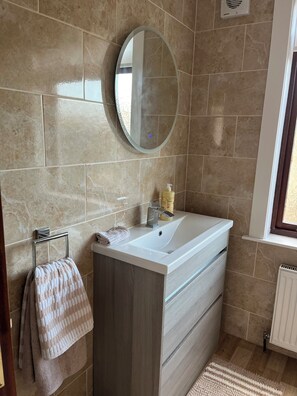 Shower, hair dryer, towels, soap