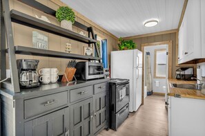 Fridge, cookware/dishes/utensils, dining tables