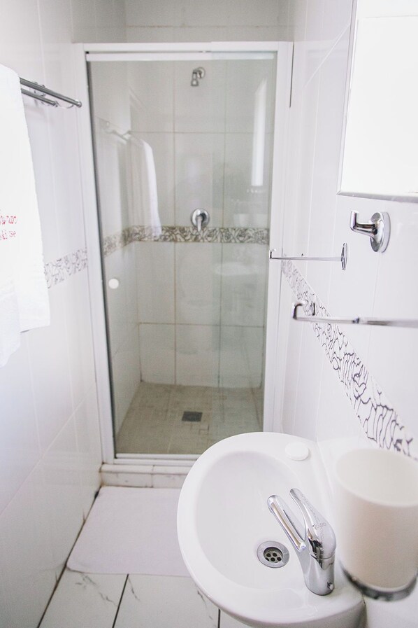 Shower, jetted tub, towels, soap