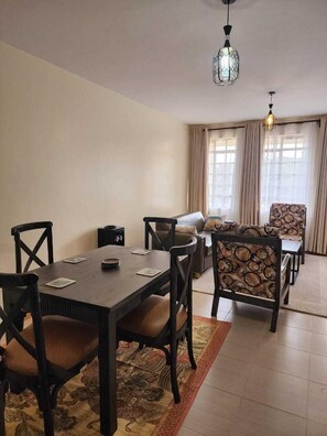 Family Apartment, Balcony, City View | In-room dining