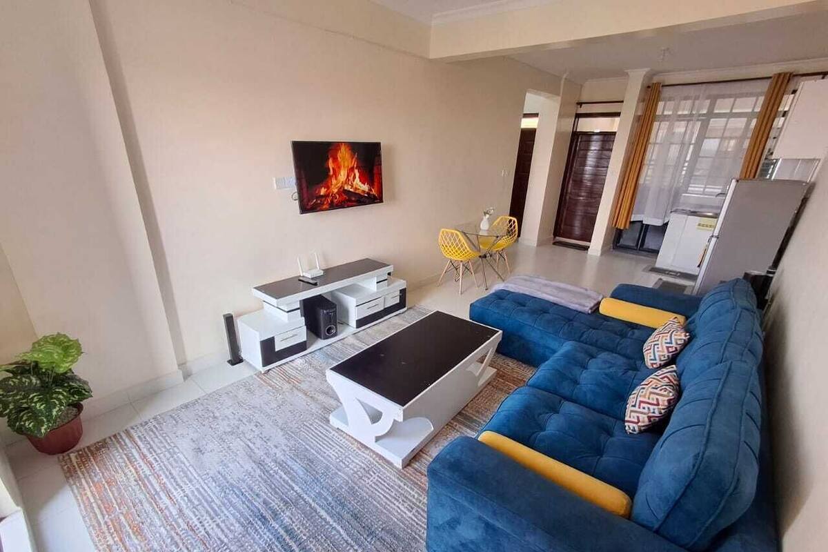 Deluxe Apartment | Living area | 32-inch Smart TV with digital channels