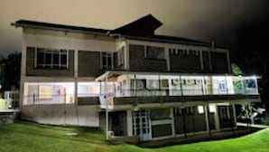 A two-story building with a flat roof and a balcony on the upper floor. - Fairways Hotel (Narok)