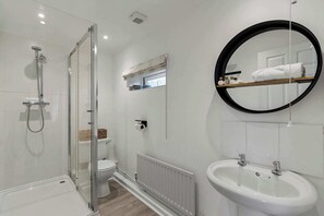 Shower, hair dryer, towels, shampoo