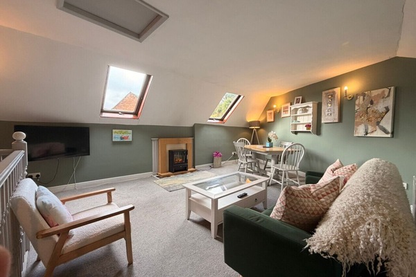 Upstairs Lounge with smart Tv and electric fire