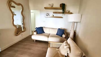 Appartement, 2 chambres, balcon, vue océan | Salle de séjour