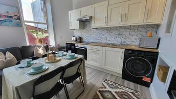 Coffee/tea maker, fridge, microwave, oven
