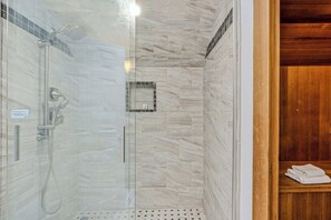 Shower, hair dryer, towels, shampoo
