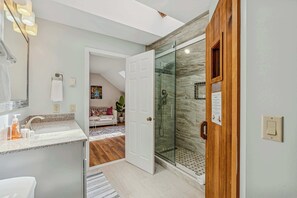 Shower, hair dryer, towels, shampoo
