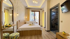 A hotel room with a bed, a mirror, a TV, and a window. - The Little Prince Hotel (Antalya)