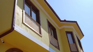 A yellow building with multiple windows and balconies. - The Little Prince Hotel (Antalya)