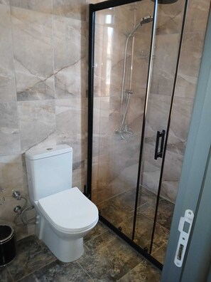 Shower, hair dryer, slippers, towels