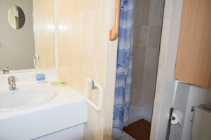 A bathroom with a sink, mirror, and shower curtain. - Magnificent Grand STUDIO 28m2+ CLIM + sea view Terrace180- / south 8m2/+Box (Asc) (Le Lavandou)