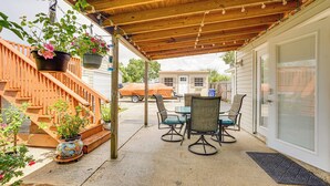 A covered patio with a wooden ceiling, outdoor furniture, and hanging plants. - 8 Mi to Beaches: Getaway w/ Pool in Panama City! (Panama City)