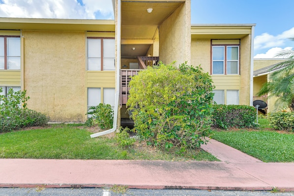 A two-story building with a balcony, a small garden, and a satellite dish. - Explore Sarasota: Condo w/ Pool Access, Near Dtwn (Sarasota)