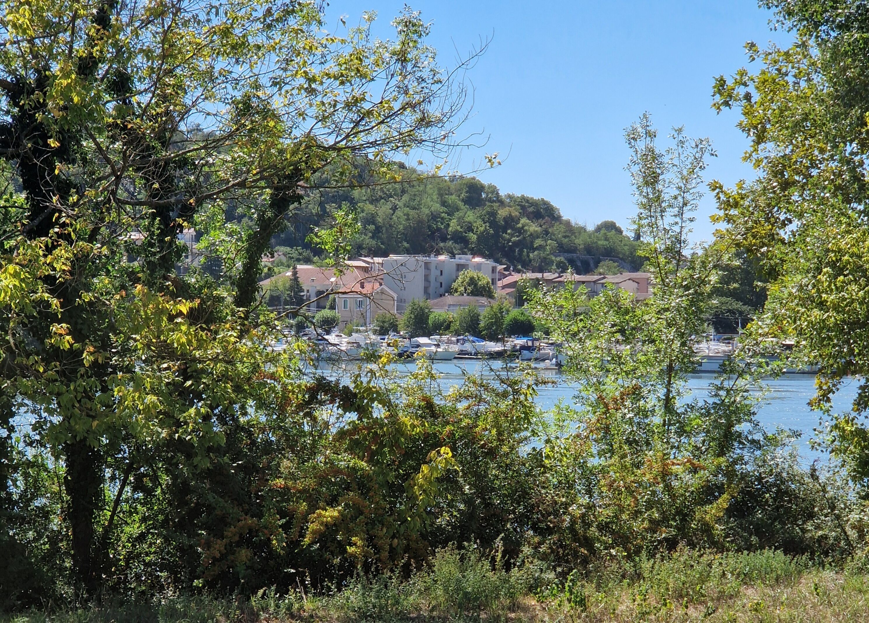 A coastal town with buildings and boats by the water.