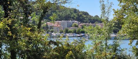 A coastal town with buildings and boats by the water.